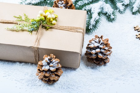 Christmas background with gift, Christmas tree branches and snow. Free spaceの写真素材