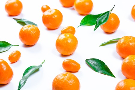 Mandarins fresh with leaves on a white background. Ripe delicious fruit. Symbol of the New Year and Christmasの写真素材