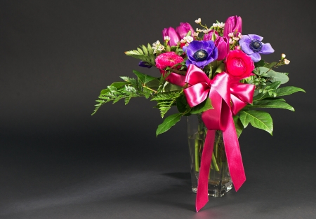 colorful spring flowers on black backgroundの写真素材