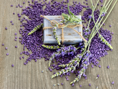 herbal lavender soap and bath salt with fresh flowers over wooden backgroundの写真素材