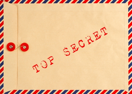 vintage airmail envelope  grungy background  text top secretの写真素材
