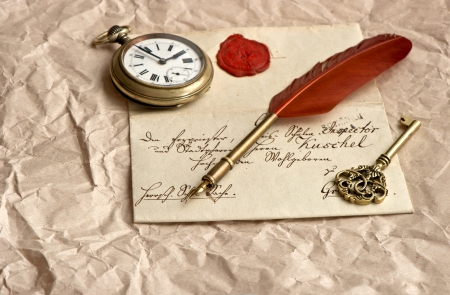 old letter with wax seal, vintage quill, clock and keyの写真素材