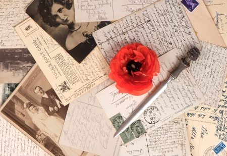 old photos and post cards with letter opener  vintage grunge background