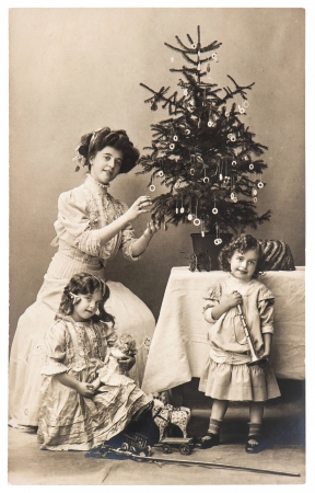 BERLIN, GERMANY - CIRCA 1900  antique family portrait of mother and children with christmas tree wearing vintage clothing, circa 1900 in Berlin, Germanyのeditorial素材