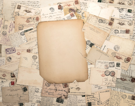 nostalgic vintage background with old handwritten post cards and grungy paper sheetの写真素材