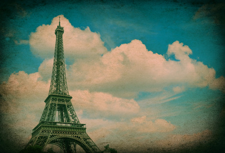 Eiffel Tower  La Tour Eiffel  against cloudy blue sky  Champ de Mars, place of interest in Paris, Europe  Vintage style pictureの写真素材