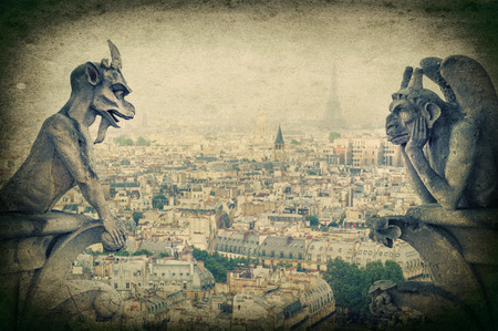 Stone demons gargoyle und chimera with Paris city on background  View from Notre Dame de Paris  Vintage style pictureの写真素材