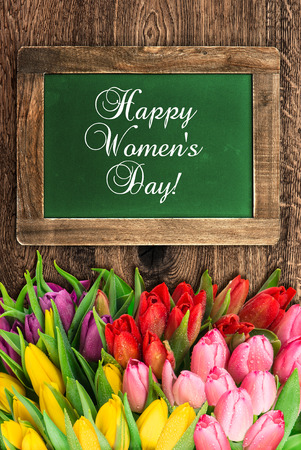 vintage green chalkboard with tulip flowers and sample text Happy Women's Day!の写真素材