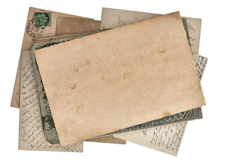grungy paper page and postcards isolated on white backgroundの写真素材