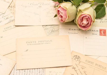vintage postcards and soft rose flowers  old love letters  romantic still lifeの写真素材