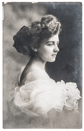 antique portrait of young woman with rose flowers retro picture with scratches and original film grain ca 1910 antique portrait of young woman with rose flowers retro picture with scratches and original film grain ca 1910