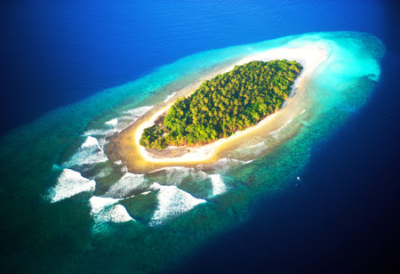 top view of tropical island in turquoise blue water  maldives panoramic landscape