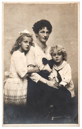 BERLIN, GERMANY - CIRCA 1910  antique family portrait of mother with children wearing vintage...