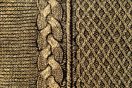 golden black knitting woolen textured backgroundの写真素材