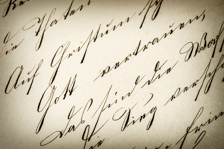 vintage handwriting. antique manuscript. aged paper background. retro style toned pictureの写真素材