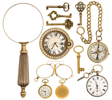 collection of golden vintage accessories, jewelry and objects. antique keys, clock, loupe, compass, glasses isolated on white background