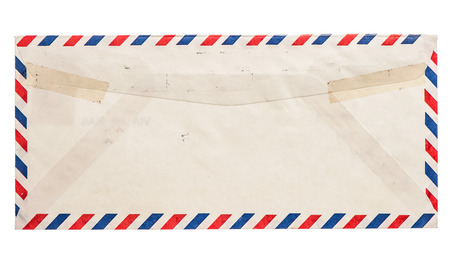 vintage grungy air mail envelope isolated on white backgroundの写真素材