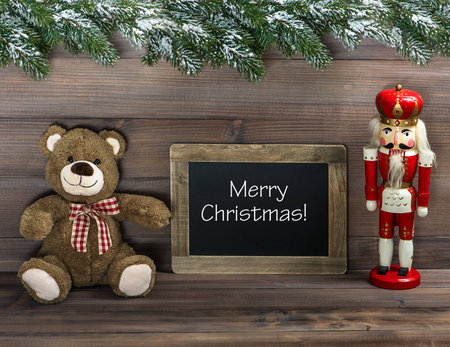 nostalgic christmas decoration with antique toys and blackboard with sample text Merry Christmas!...