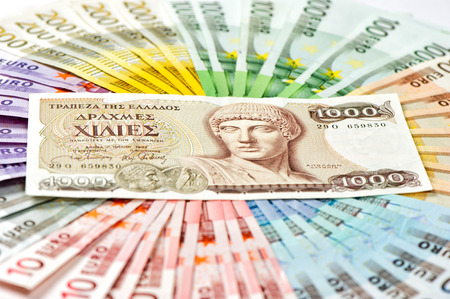 old greek drachma and euro cash banknotes. greece euro crisis conceptの写真素材