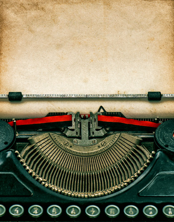 Vintage typewriter with aged textured grungy paperの写真素材