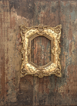 Baroque golden frame over rustic wooden background. Grunge wood textureの写真素材