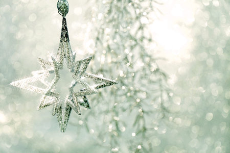 Christmas Ornament Silver Star with Magic Lights Decoraion. Selective focus. Blurred Effect