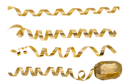 Golden serpentine streamers isolated on white background. Holidays party decorationの写真素材