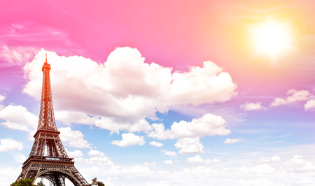 Eiffel Tower against blue colorful sunset sky. Champ de Mars, Paris, Europe. Vintage style toned photoの写真素材