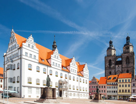 Market square in Wittenberg, main square of old german town. Monuments of Martin Luther and Philipp Melanchthon. Wittenberg is Luther City in Germanyのeditorial素材