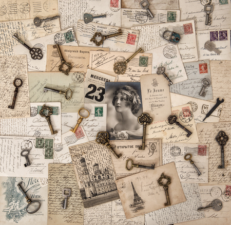 Old letters, postcards and keys. Portrait of young woman with rose flowerの写真素材