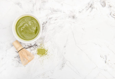Macha tea cup on marble stone background. Traditional japanese drink