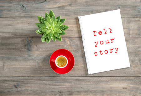 Tell your story. Creative workplace flat lay. Notebook, cup of coffee, succulentの写真素材