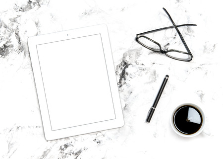 Minimal flat lay. Office workplace digital tablet pc, coffeeの写真素材