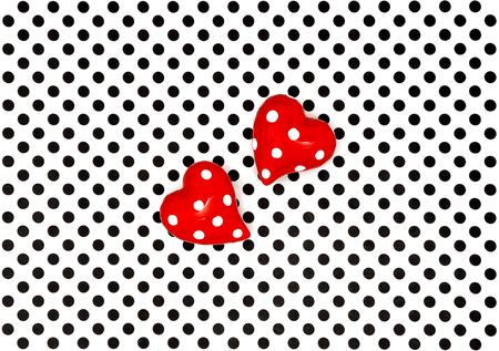 Red hearts on black white polka dot backgroundの写真素材