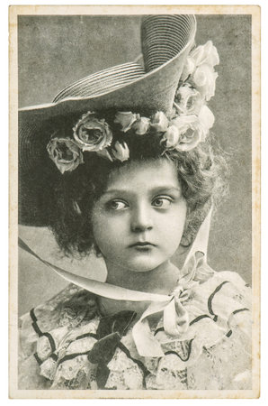 Little girl in vintage dress. Old portrait picture with original film grain and blur