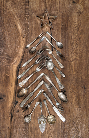 Christmas decoration from cutlery on wooden backgroundの写真素材