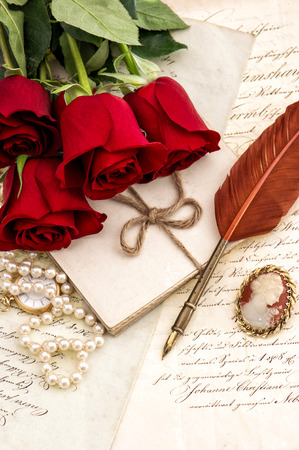 Old letters, red rose flowers and antique feather pen. Valentined Day Love conceptの写真素材