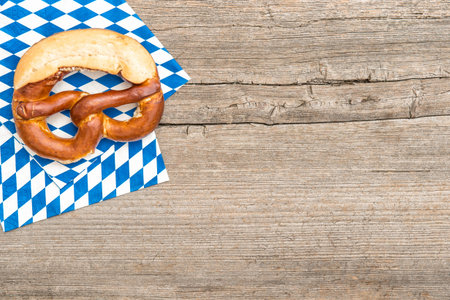 Bavarian bread pretzel on wooden board background