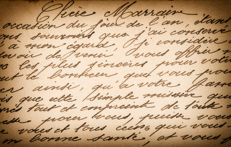Used paper unreadable handwritten text. Grunge vintage texture background with vignetteの写真素材