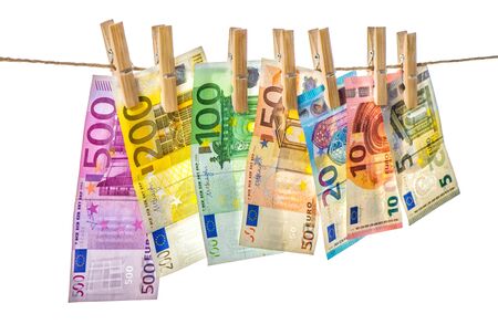 Money background. Euro banknotes hangingwith clothes pinsの写真素材