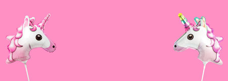 Pink banner with unicorn horse foil balloon. Kids party background