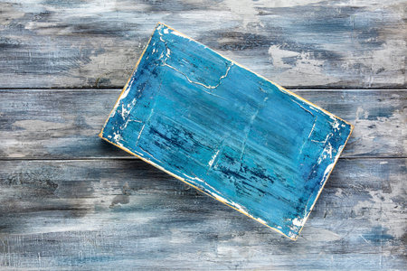 Wooden distressed weathered background. Rustic shabby blue desk