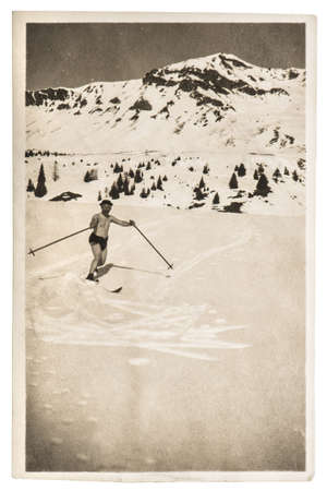 Vintage photo from skiing man in snow. Antique picture with original film grain and scratchesのeditorial素材