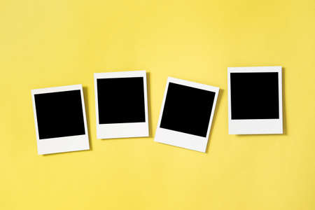 Retro style photo frames on yellow backgroundの写真素材
