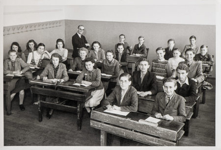 Young people classmates and teachers in the classroom. Vintage photo original film grain, blur and...