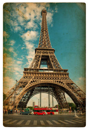 The Eiffel Tower (La Tour Eiffel) in Paris over cloudy blue sky. Vintage style designed pictureのeditorial素材