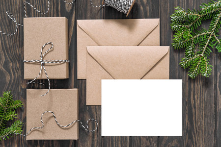 Christmas letter paper gift boxes on wooden background. Vintage style mock up