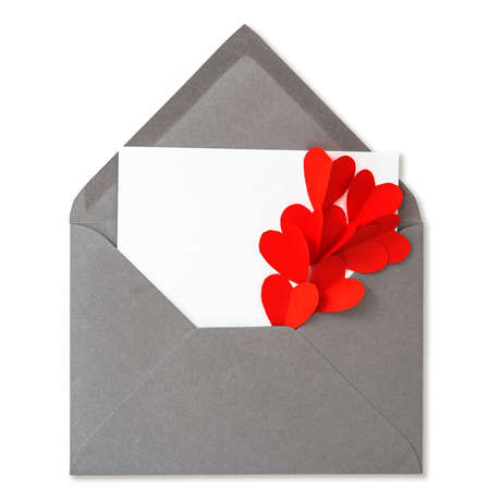 Valentine's Day card with red paper hearts decoration on white backgroundの写真素材