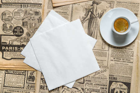 Napkin mockup and cup coffee on vintage style backgroundの写真素材