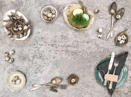 Easter table place setting with eggs decoration. Template backgroundの写真素材